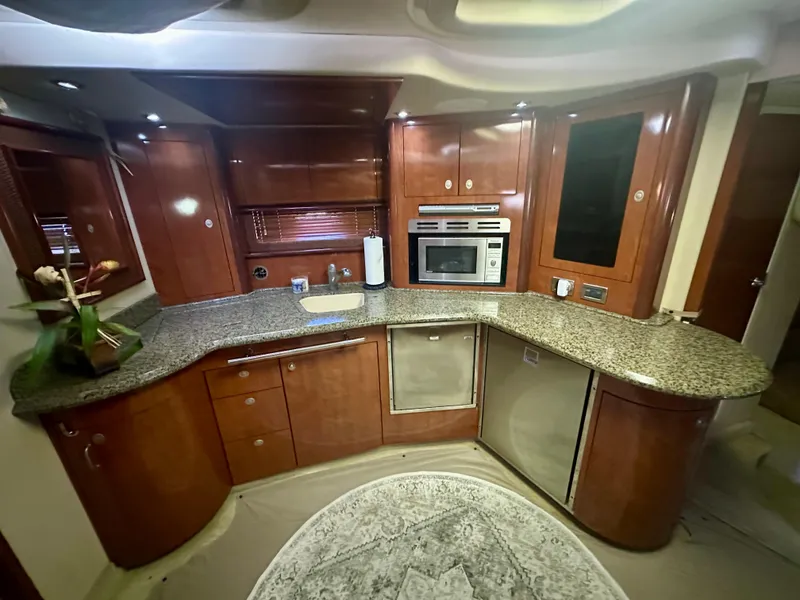 Slide: The Image of Luxurious kitchen interior of 2005 Sea Ray 420 Sundancer yacht with granite countertops. - 17