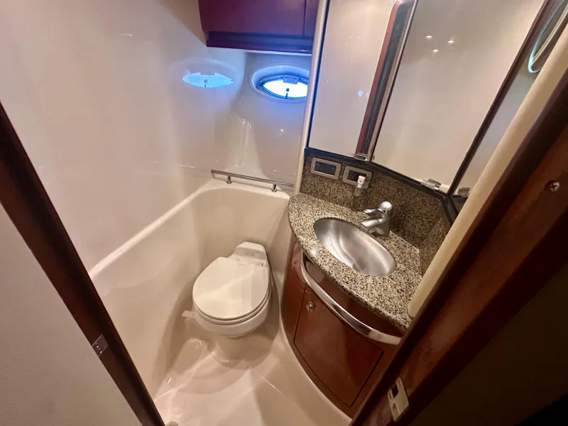 Slide: The Image of Luxurious bathroom in 2005 Sea Ray 420 Sundancer yacht with granite countertop and modern fixtures. - 22