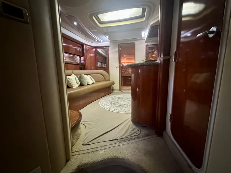 Slide: The Image of Luxurious interior of 2005 Sea Ray 420 Sundancer yacht with elegant seating and ambient lighting. - 23