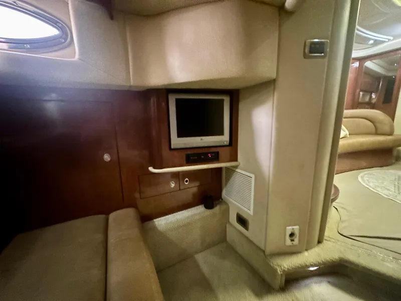 Slide: The Image of Interior of 2005 Sea Ray 420 Sundancer yacht with TV and seating area. - 25