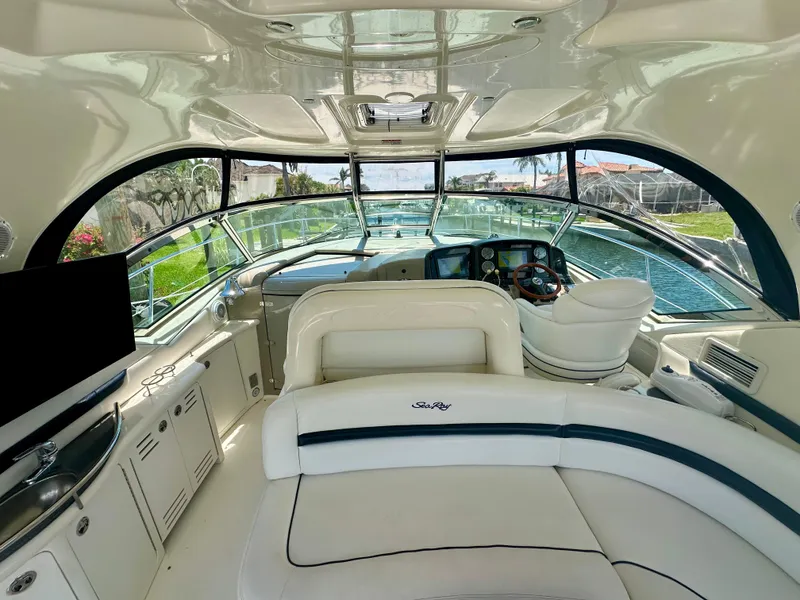 Slide: The Image of Interior of 2005 Sea Ray 420 Sundancer yacht with luxurious seating and helm. - 8