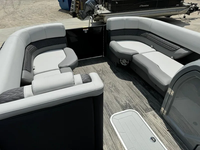 Slide: The Image of 2024 Godfrey Monaco 235 SB pontoon boat interior with luxurious seating and canopy. - 10