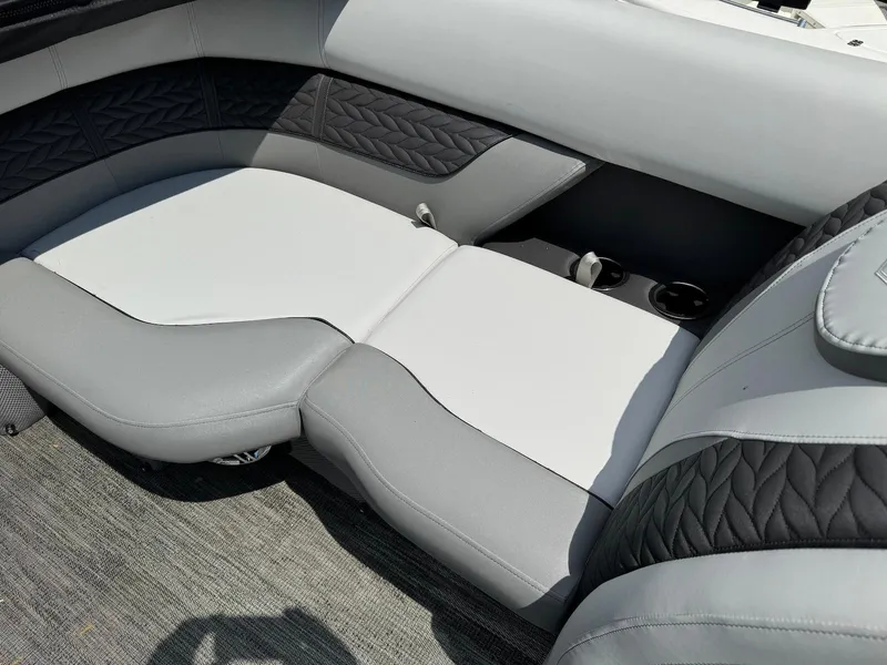 Slide: The Image of 2024 Godfrey Monaco 235 SB boat interior with luxurious seating and modern design. - 11