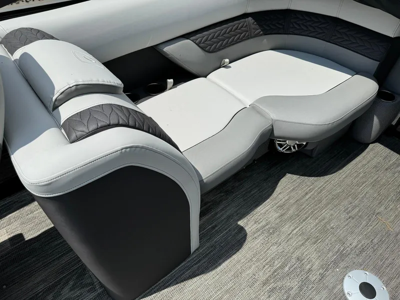 Slide: The Image of 2024 Godfrey Monaco 235 SB boat seat with elegant gray and white design. - 12