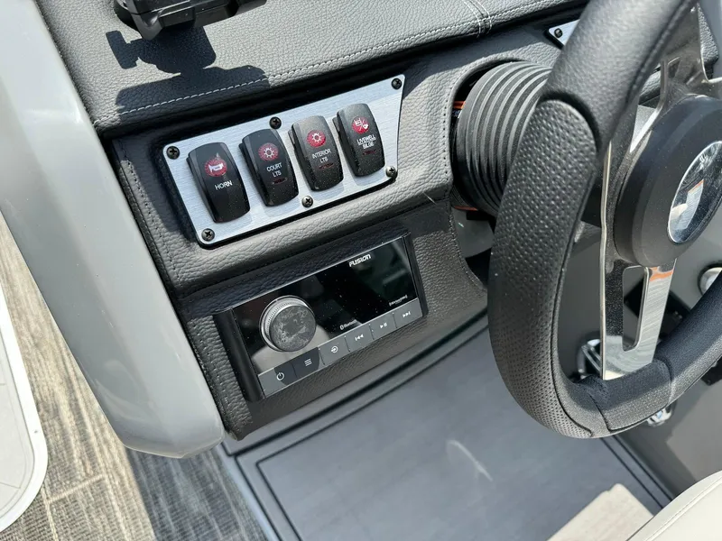 Slide: The Image of 2024 Godfrey Monaco 235 SB boat interior with storage compartment and seating. - 20