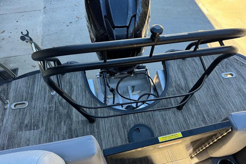 Slide: The Image of 2024 Godfrey Monaco 235 SB boat deck with motor and safety railing. - 33