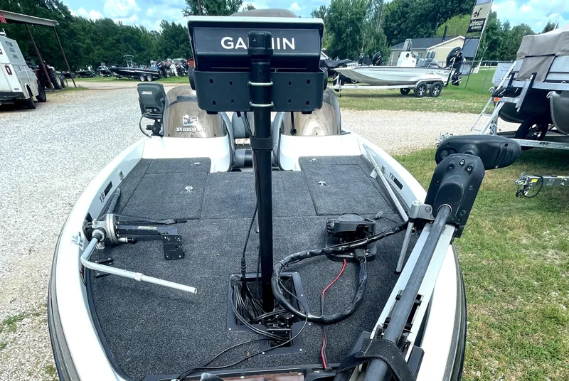 Slide: The Image of 2006 Ranger 521DVX Comanche boat with Garmin equipment, parked outdoors. - 2