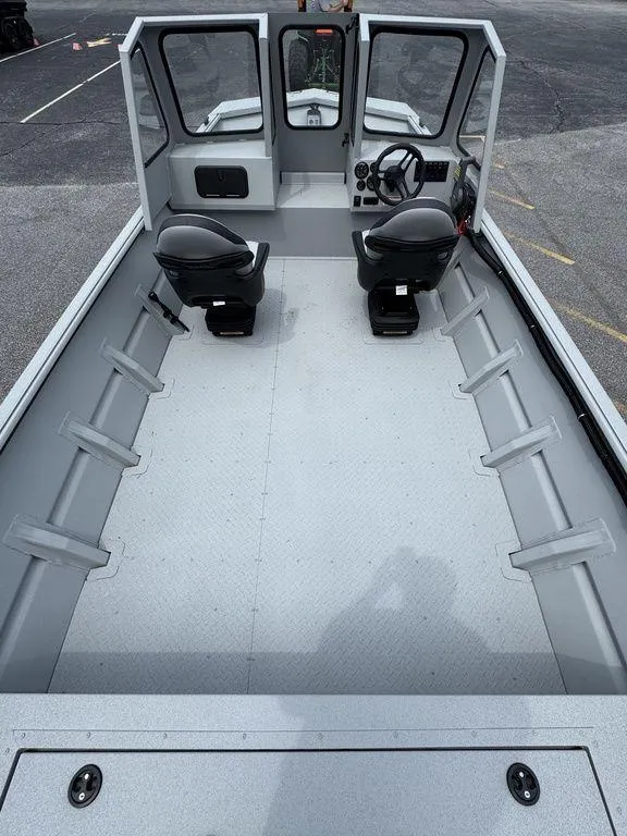 Slide: The Image of 2026 SeaArk 2072 MV Flat Cat boat interior with dual seats and steering console. - 11