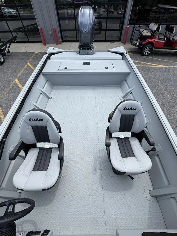 Slide: The Image of 2026 SeaArk 2072 MV Flat Cat boat interior with two seats and steering console. - 17