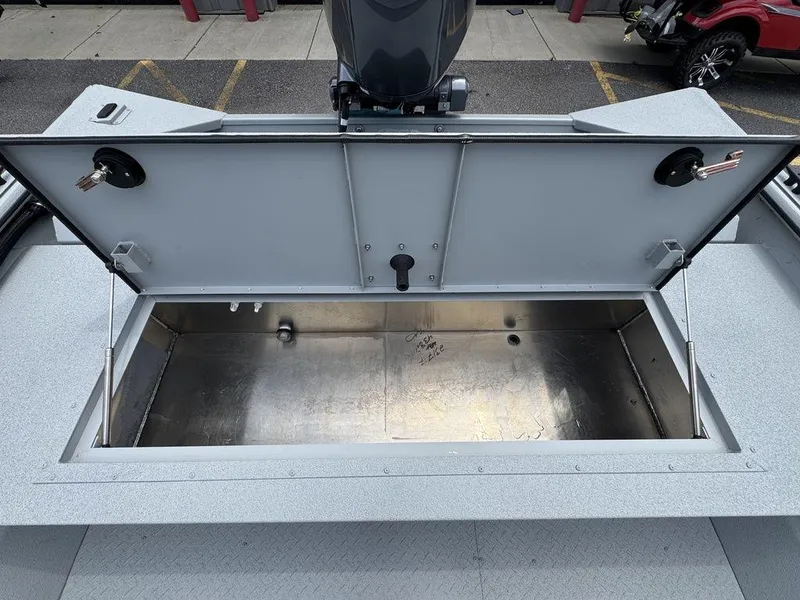 Slide: The Image of Open storage compartment on 2026 SeaArk 2072 MV Flat Cat boat. - 18