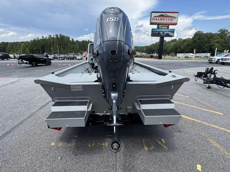 Slide: The Image of 2026 SeaArk 2072 MV Flat Cat boat with Yamaha 150 engine in parking lot. - 9