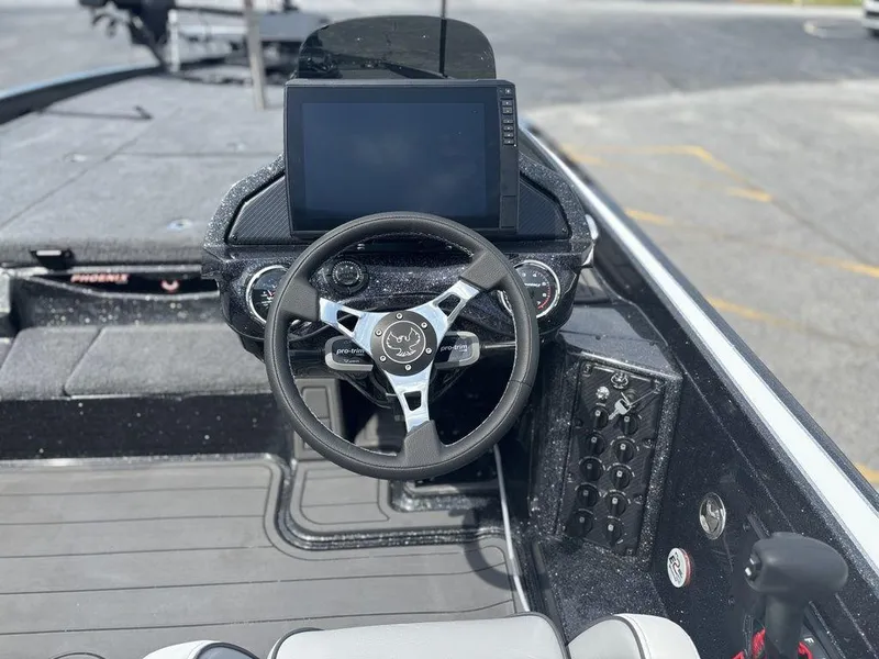 Slide: The Image of 2026 Phoenix 921 Elite X II boat dashboard with steering wheel and digital display. - 10