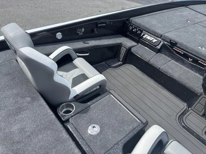Slide: The Image of Interior of 2026 Phoenix 921 Elite X II boat with sleek seating and modern design. - 12