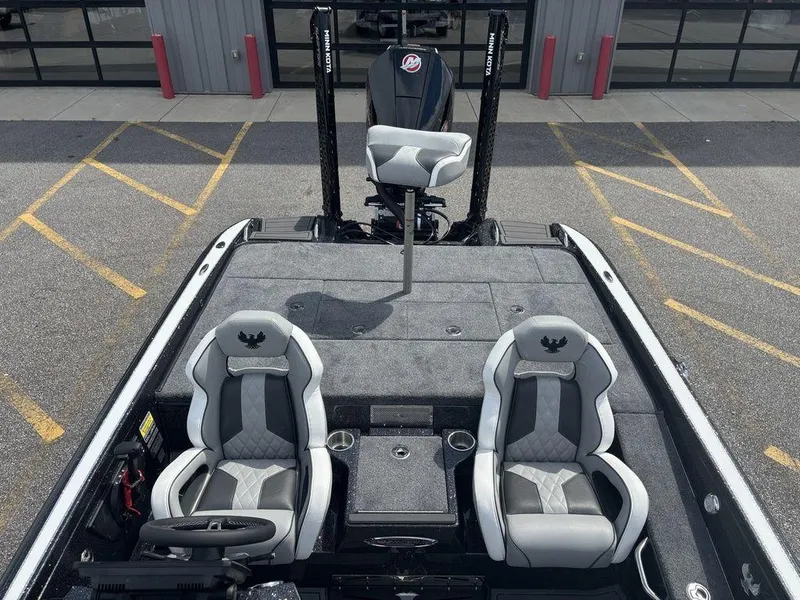 Slide: The Image of 2026 Phoenix 921 Elite X II boat interior with dual seats and steering wheel. - 13