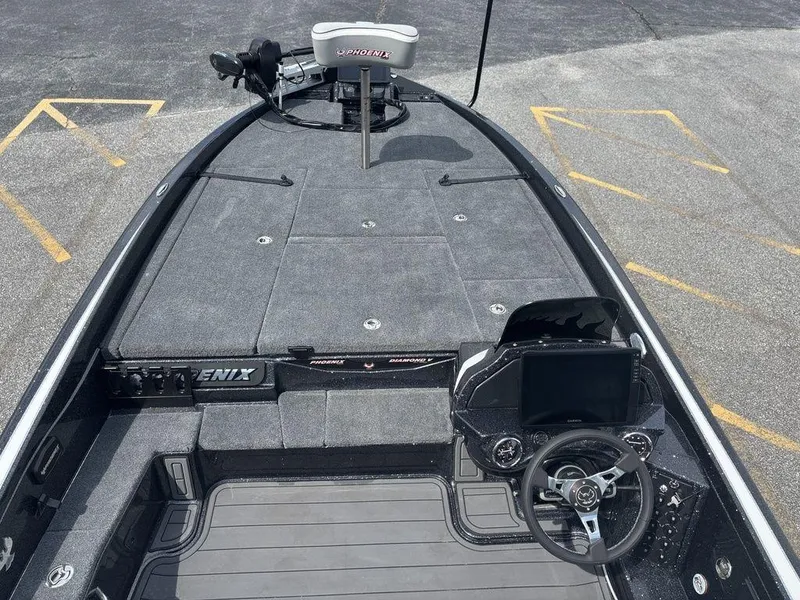 Slide: The Image of 2026 Phoenix 921 Elite X II boat interior with steering wheel and control panel. - 14