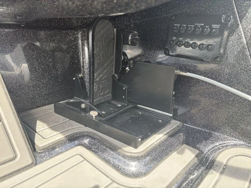 Slide: The Image of Foot pedal and control panel in 2026 Phoenix 921 Elite X II boat. - 17