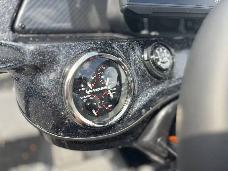Slide: The Image of Dashboard of 2026 Phoenix 921 Elite X II with detailed gauges. - 19