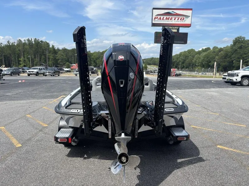 Slide: The Image of 2026 Phoenix 921 Elite X II boat at dealership parking lot, rear view. - 3