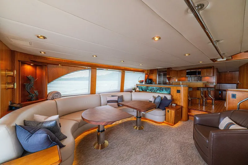 Slide: The Image of Luxurious interior of 2002 Queenship 98 Yachtfish, featuring elegant seating and modern amenities. - 3