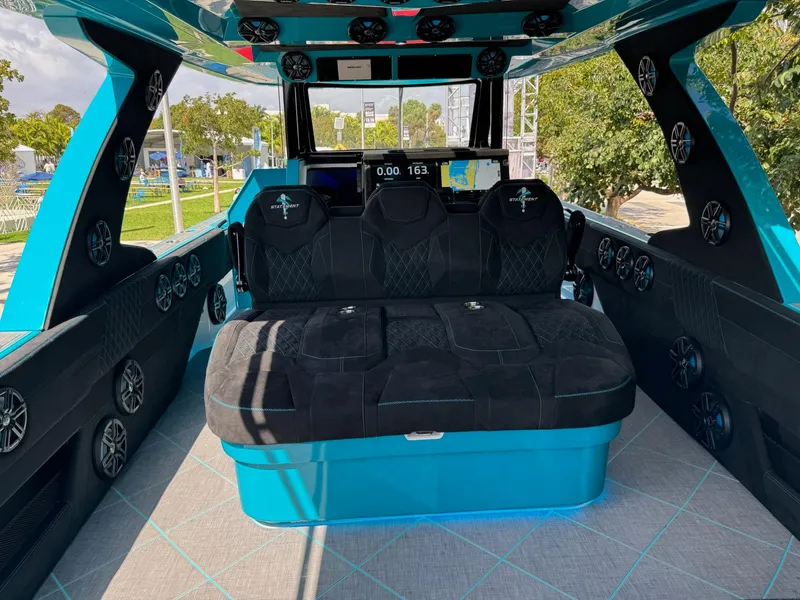 Slide: The Image of Interior of 2026 Statement 430 Tigress Catamaran with plush seating and modern dashboard. - 10