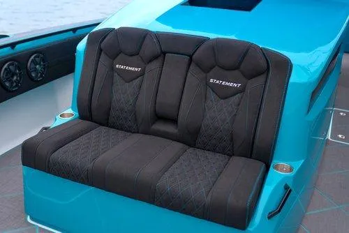 Slide: The Image of 2026 Statement 430 Tigress Catamaran, luxurious black seating, turquoise accents, center console design. - 11