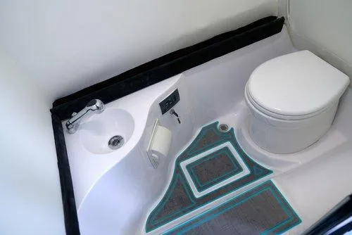 Slide: The Image of 2026 Statement 430 Tigress Catamaran bathroom with modern sink and toilet design. - 16