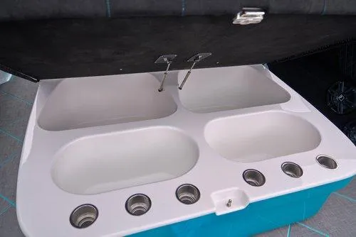 Slide: The Image of Livewell compartments on 2026 Statement 430 Tigress Center Console Catamaran. - 17