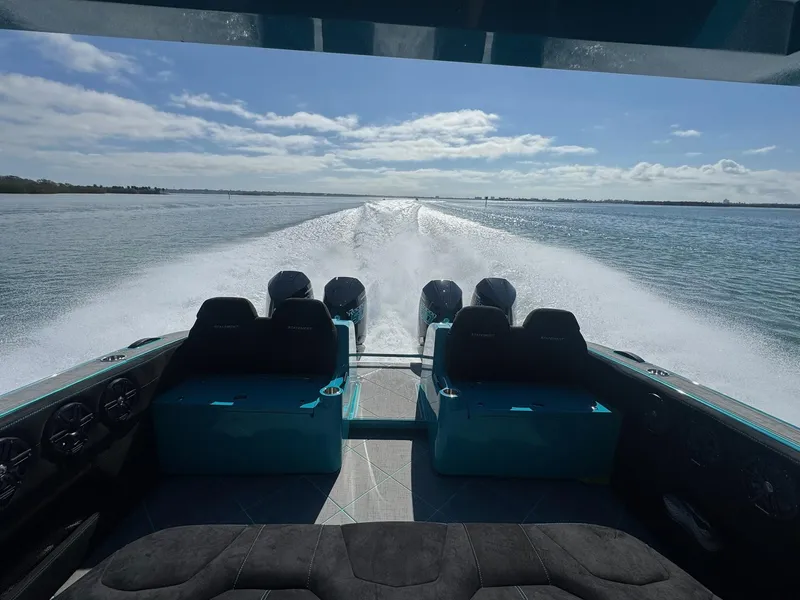 Slide: The Image of 2026 Statement 430 Tigress Catamaran cruising on open water, showcasing powerful engines and sleek design. - 20