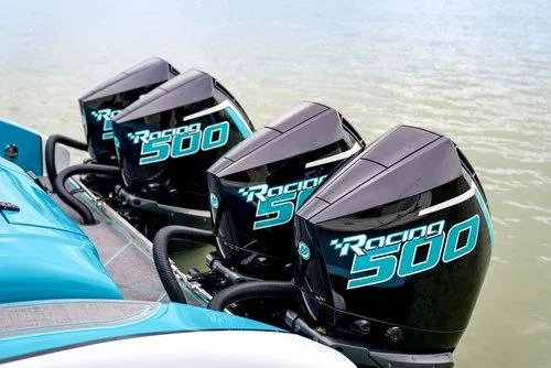 Slide: The Image of Four Racing 500 outboard motors on a 2026 Statement 430 Tigress Catamaran. - 5
