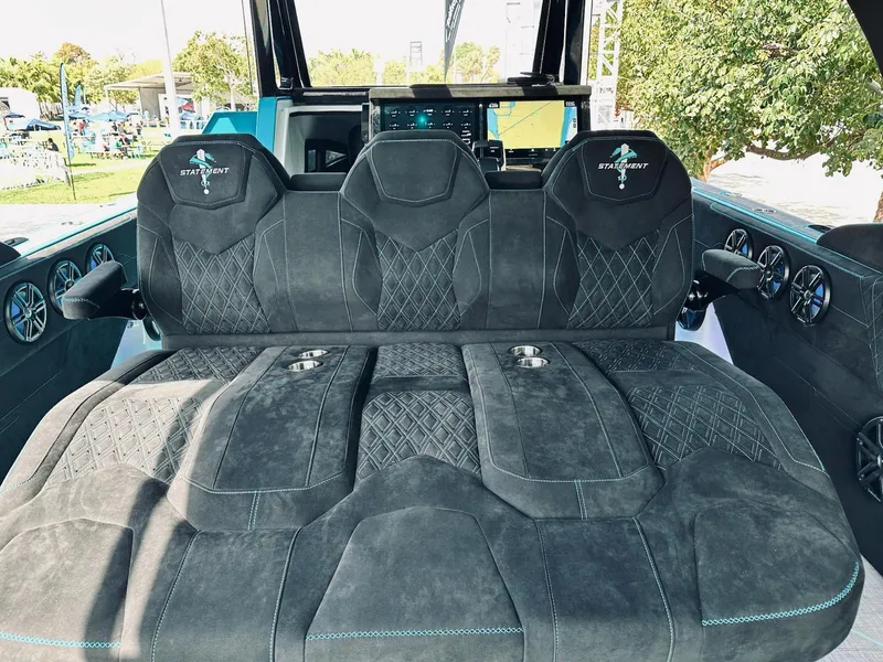 Slide: The Image of Luxurious seating in 2026 Statement 430 Tigress Center Console Catamaran with advanced dashboard. - 7
