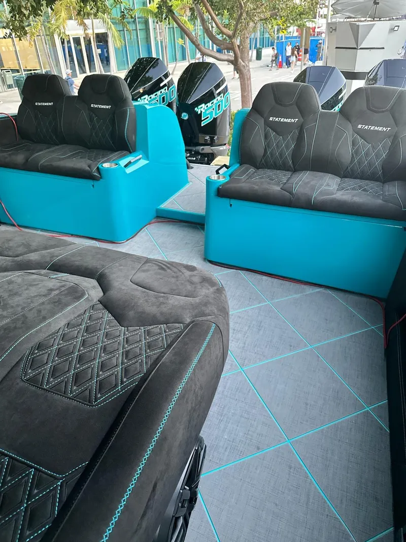 Slide: The Image of 2026 Statement 430 Tigress Catamaran interior with luxurious seating and powerful engines. - 9
