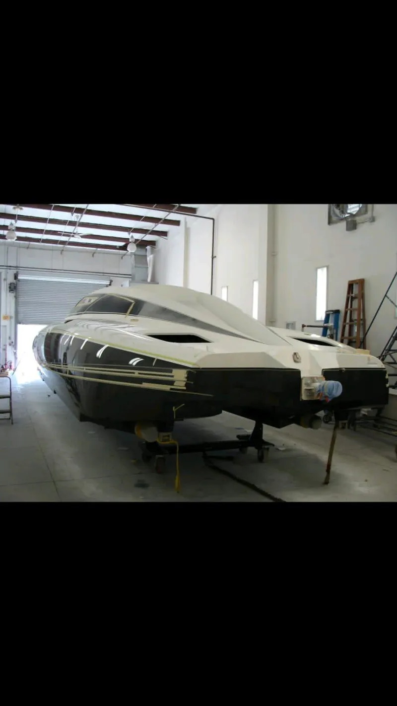 Slide: The Image of 2012 Mystic Powerboats 50 Cat in a garage, rear view. - 4