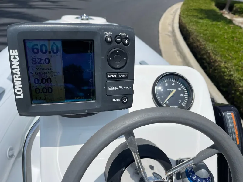 Slide: The Image of Steering console of 2013 AB Inflatables Lammina 10 AL with Lowrance Elite-5 DSI display. - 11