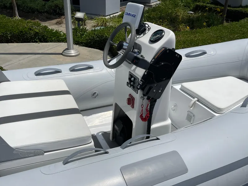 Slide: The Image of 2013 AB Inflatables Lammina 10 AL boat interior with steering console and seating. - 14