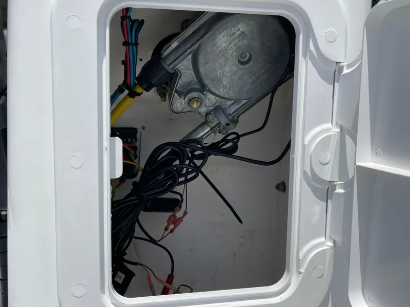 Slide: The Image of Open compartment of 2013 AB Inflatables Lammina 10 AL showing wiring and mechanical components. - 16