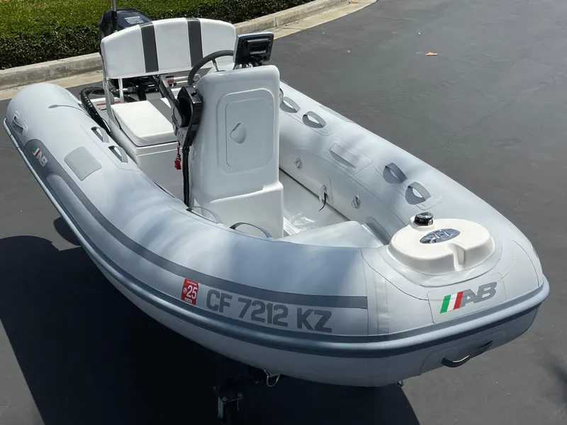Slide: The Image of 2013 AB Inflatables Lammina 10 AL boat, gray, parked on pavement. - 19