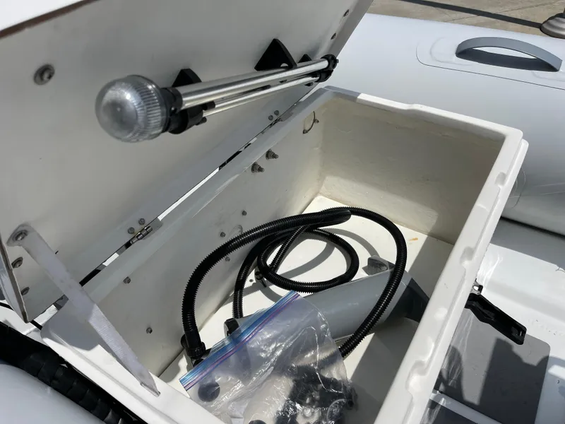 Slide: The Image of Open storage compartment of 2013 AB Inflatables Lammina 10 AL boat with pump and accessories. - 21
