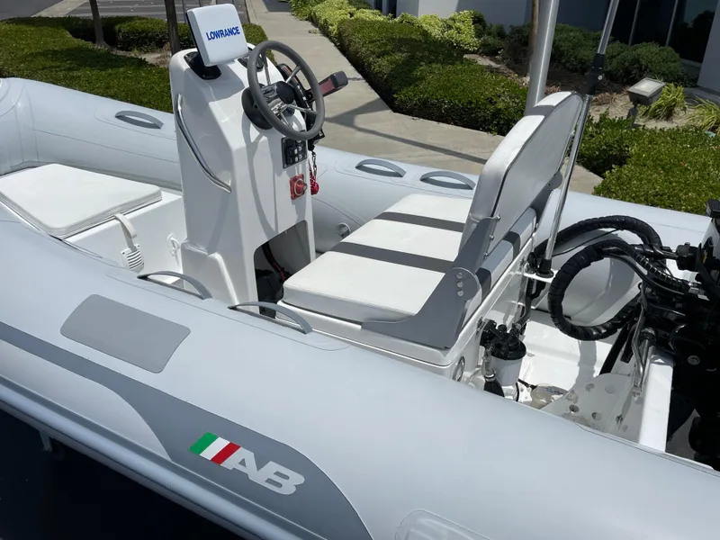 Slide: The Image of 2013 AB Inflatables Lammina 10 AL boat with steering console and seating. - 3