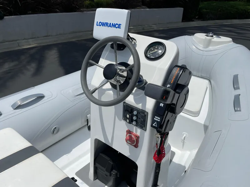 Slide: The Image of 2013 AB Inflatables Lammina 10 AL boat console with steering wheel and controls. - 6