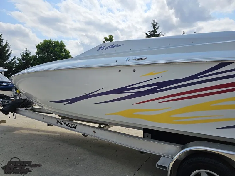 Slide: The Image of 2007 Baja 35 Outlaw boat with colorful graphics on a trailer. - 25