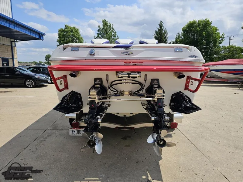 Slide: The Image of 2007 Baja 35 Outlaw boat rear view with dual propellers and red accents. - 29