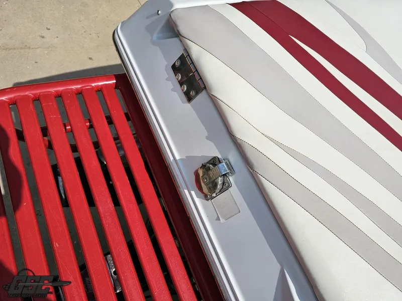 Slide: The Image of 2007 Baja 35 Outlaw boat seat with red and white upholstery detail. - 34