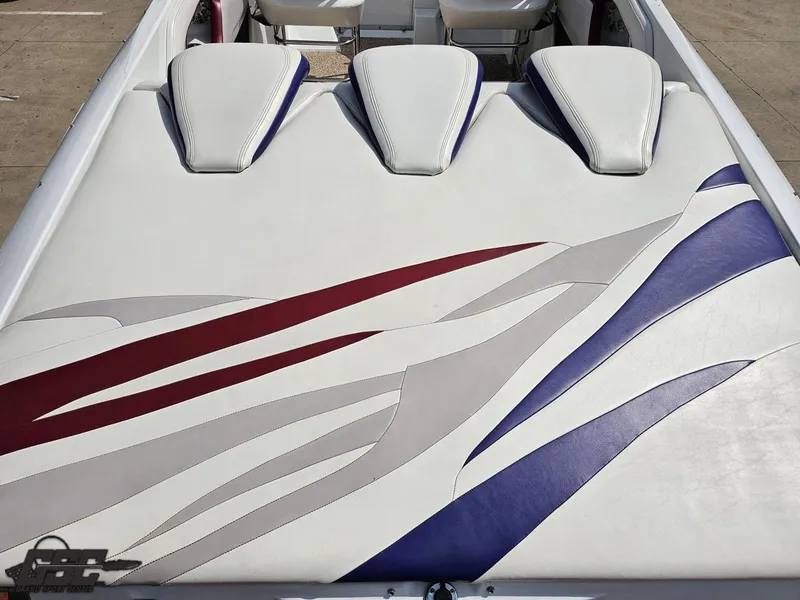 Slide: The Image of 2007 Baja 35 Outlaw boat interior with white, red, and blue upholstery design. - 36