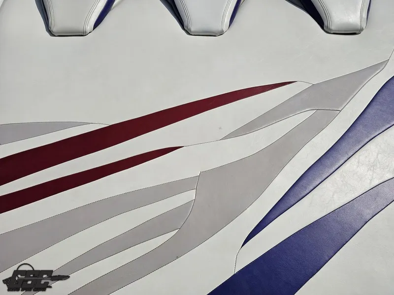 Slide: The Image of 2007 Baja 35 Outlaw boat interior with red, gray, and blue wave patterns. - 39