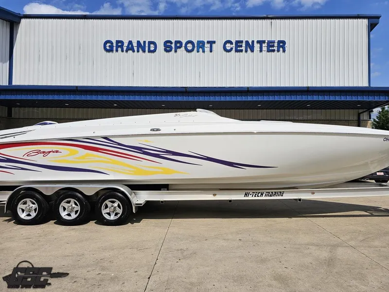 Slide: The Image of 2007 Baja 35 Outlaw boat with colorful graphics at Grand Sport Center. - 4