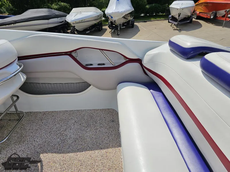 Slide: The Image of 2007 Baja 35 Outlaw boat interior with white, red, and blue seating. - 48