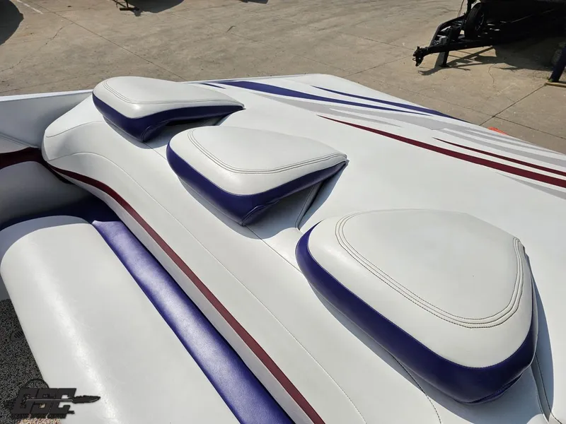 Slide: The Image of 2007 Baja 35 Outlaw boat seats with white and blue upholstery. - 49