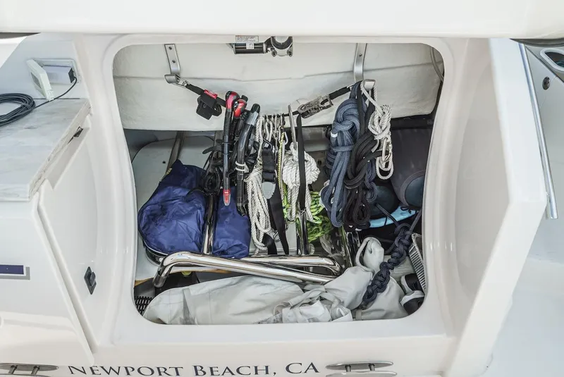 Slide: The Image of Storage compartment of 2016 Tiara Yachts C44 Coupe with ropes and equipment, Newport Beach, CA. - 15