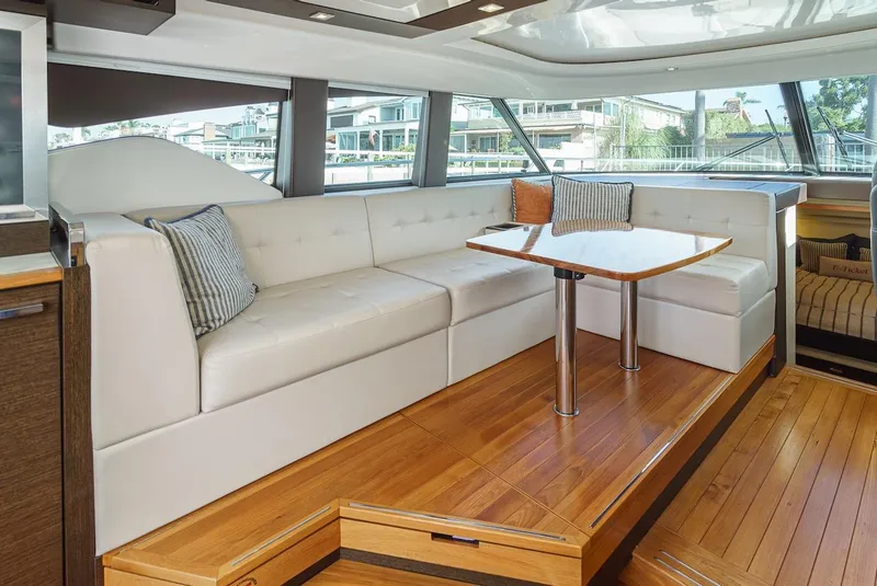 Slide: The Image of Luxurious interior of 2016 Tiara Yachts C44 Coupe with elegant seating and wooden flooring. - 20