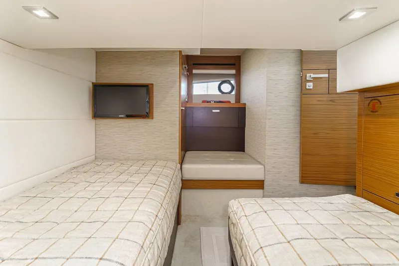 Slide: The Image of Interior of 2016 Tiara Yachts C44 Coupe with twin beds and modern decor. - 40